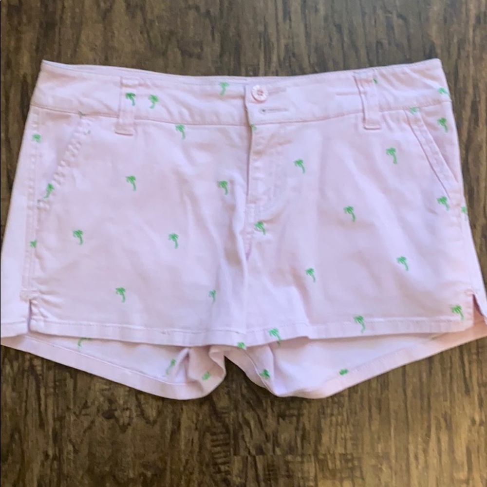 Pink shorts with green palm trees
